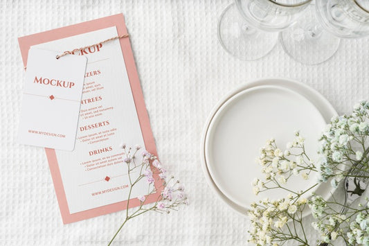 Free Top View Of Table Arrangement With Spring Menu Mock-Up And Glasses Psd