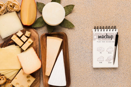Free Top View Of Variety Of Cheese With Notebook And Pen Psd