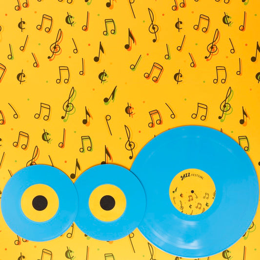 Free Top View Of Vinyls On Yellow Background Psd