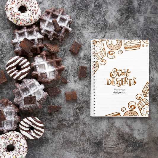Free Top View Of Waffles And Donuts With Notebook Psd