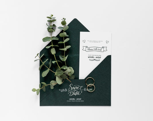 Free Top View Of Wedding Card With Plants And Rings Psd