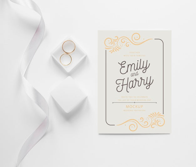 Free Top View Of Wedding Card With Ribbon And Rings Psd