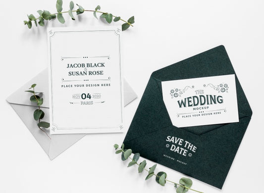 Free Top View Of Wedding Cards With Envelope And Plants Psd