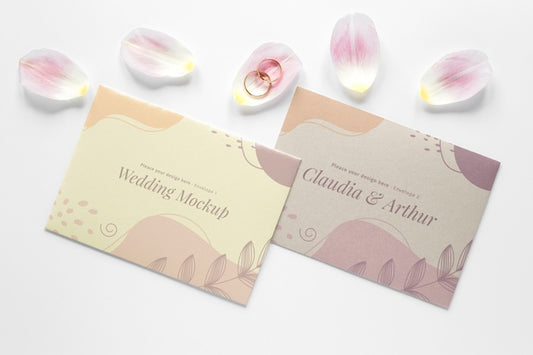 Free Top View Of Wedding Cards With Petals And Rings Psd