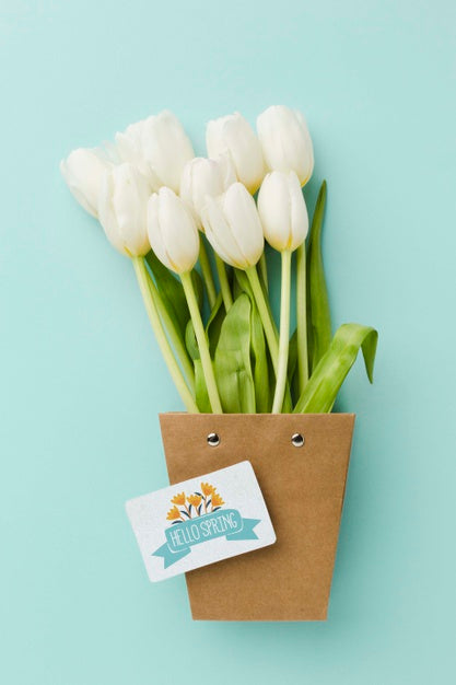 Free Top View Of White Tulips With Card Psd