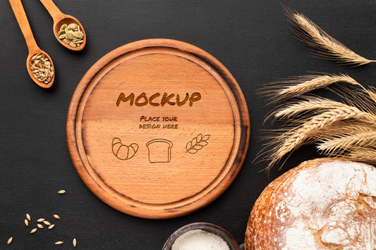 Free Top View Of Wooden Board With Bread And Wheat Psd