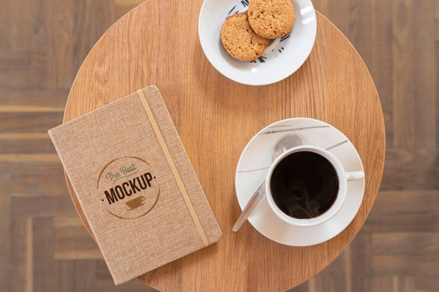 Free Top View On Cup Of Coffee With Notebook  Mockup Psd