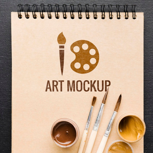 Free Top View Painting Brushes On Notebook Psd