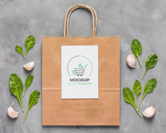Free Top View Paper Bag Mock-Up And Leaves Psd