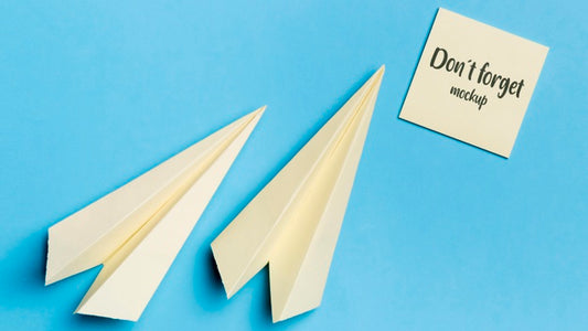 Free Top View Paper Plane And Sticky Note With Mock-Up Psd