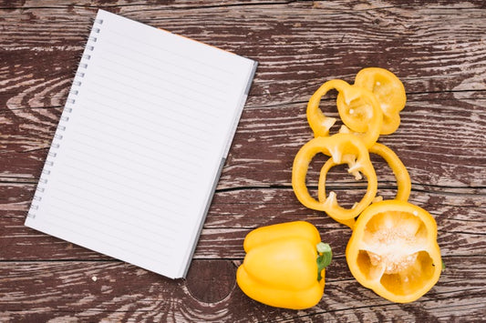 Free Top View Peppers With Notebook Psd