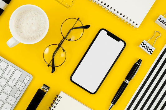 Free Top View Phone Mock-Up With Glasses And Cup Psd