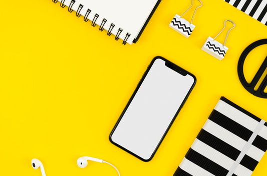 Free Top View Phone Mock-Up With Notepad And Earphones Psd
