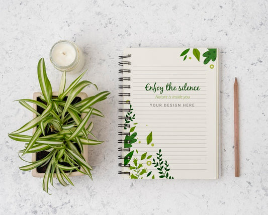 Free Top View Plant Surrounded By Notepad With Mock-Up Psd