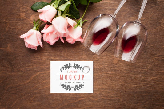 Free Top View Roses And Glasses Arrangement Psd