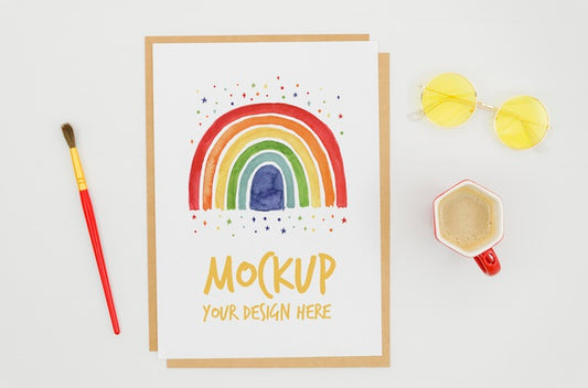 Free Top View Stationery Mock-Up With Rainbow On Paper Psd