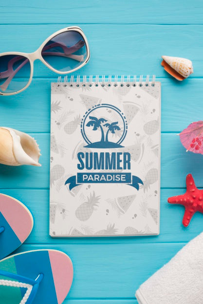 Free Top View Summer Notepad With Sunglasses On The Table Psd