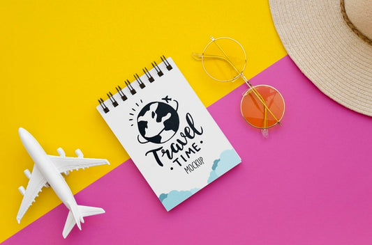 Free Top View Travelling Plane And Notepad With Lettering Psd