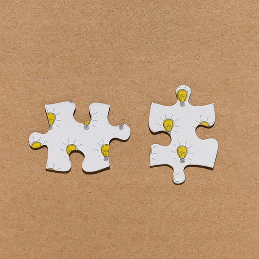 Free Top View Two Puzzle Pieces On Brown Background Psd