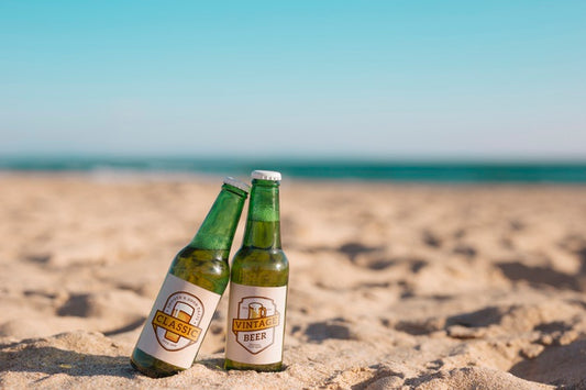 Free Two Beer Bottles Mockup At The Beach Psd