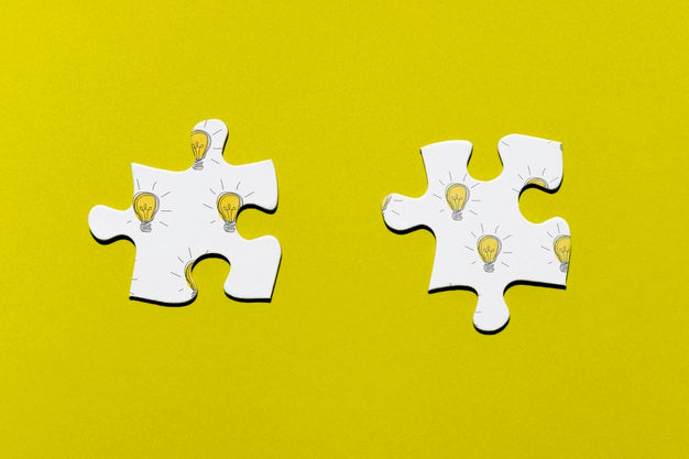 Free Two Puzzle Pieces On Yellow Background Psd