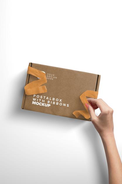 Free Vertical Mockup Woman Hand Opening Postal Box With Ribbons Psd