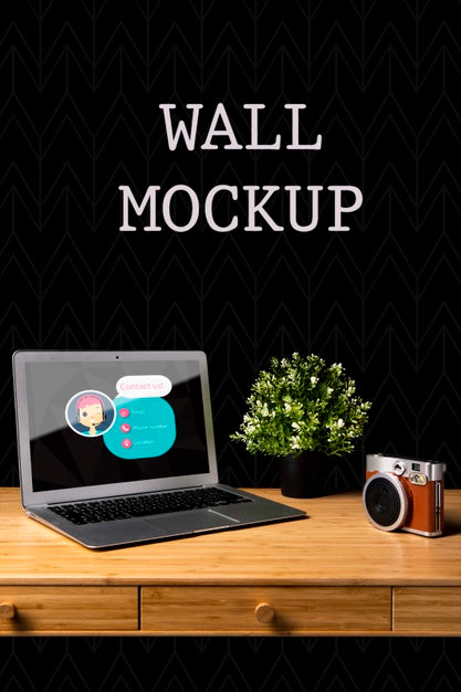 Free Wall Mock-Up With Camera And Laptop Psd