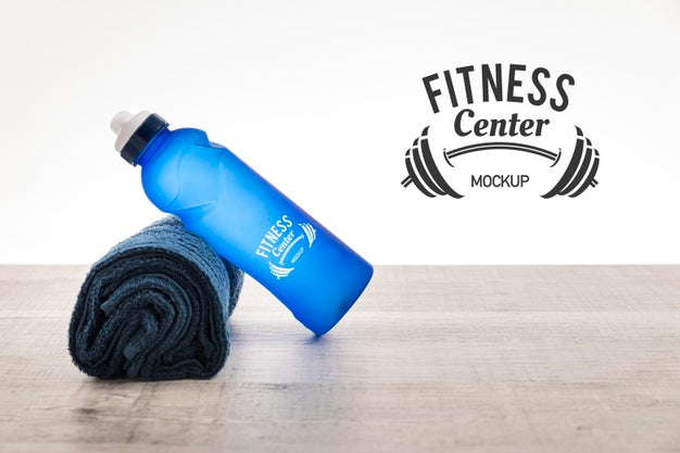 Free Water Bottle And Towel Mock-Up Psd