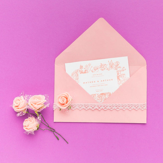 Free Wedding Invitation And Flowers On Purple Background Psd