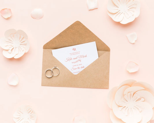 Free Wedding Rings And Invitation Mock-Up With Paper Flowers And Petals Psd