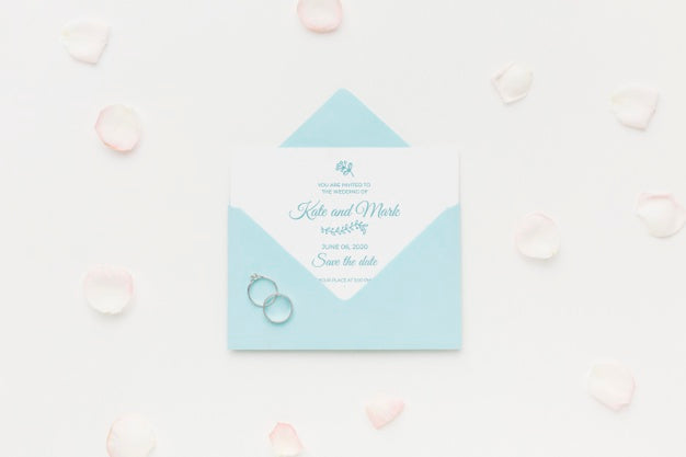 Free Wedding Rings And Invitation Mock-Up With Petals Psd