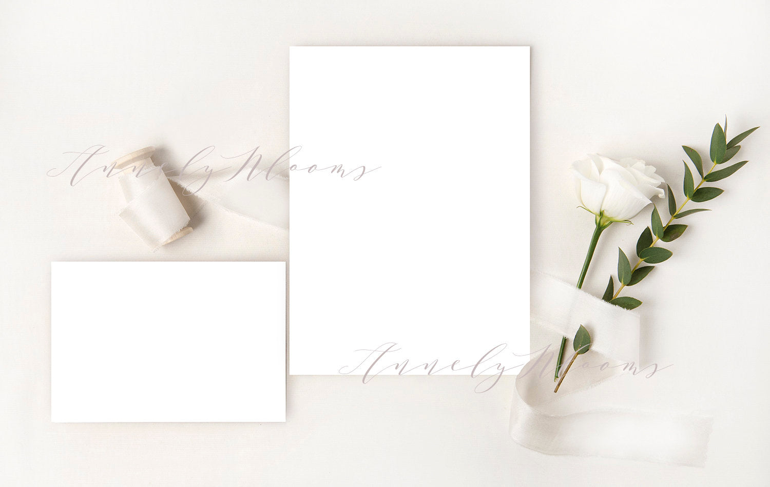 Free Wedding Wedding Mockup With Silk Ribbon, White Rose And Eucalyptus Foliage. Elegant Mockup For Your Wedding Designs.
