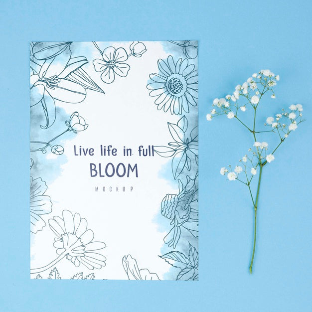 Free White Flower Placed Next To Card Mockup Psd