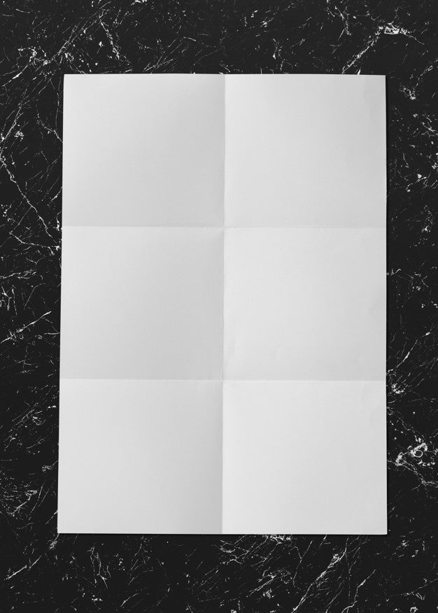 Free White Folded Paper On Marble Mockup Psd