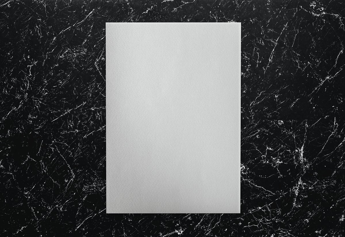 Free White Paper On A Black Marble Background