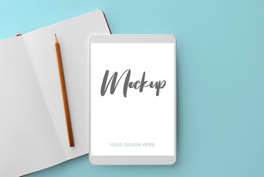 Free White Tablet On Blue With Notebook And Pencil Mockup Psd