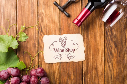 Free Wine Bottle And Grapes On Table Psd