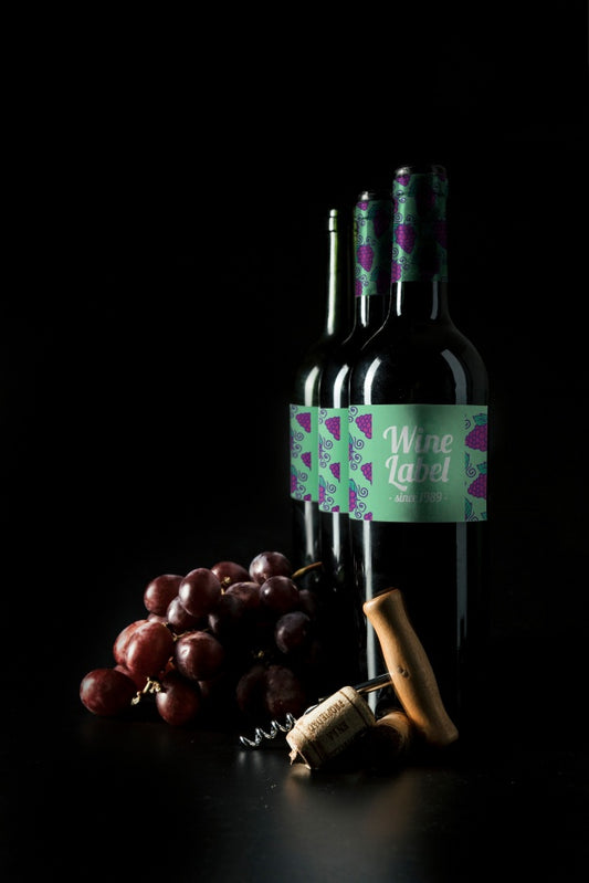 Free Wine Mockup With Bottles In Row And Grapes Psd