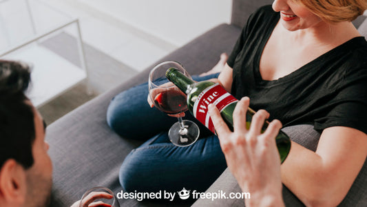 Free Wine Mockup With Couple On Couch Psd