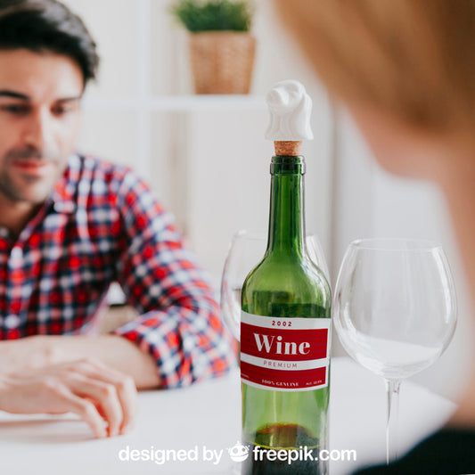 Free Wine Mockup With Man At Table Psd