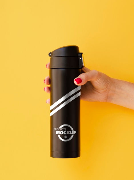 Free Woman Holding A Black Thermos Mock-Up On Yellow Background Psd