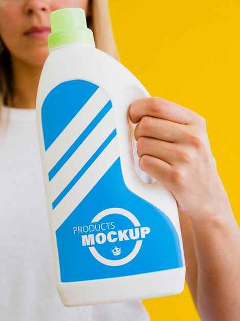 Free Woman Holding A Cleaning Bottle Mock-Up Psd