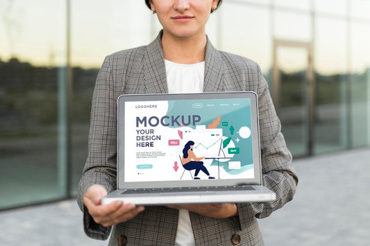 Free Woman Holding A Mock-Up Laptop For Work Psd