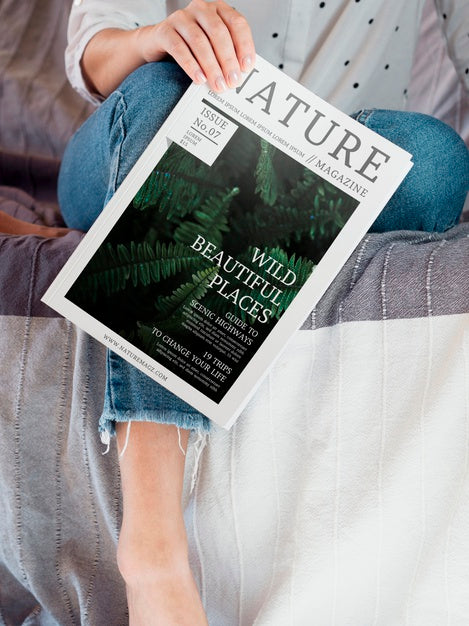 Free Woman Holding A Nature Magazine Next To Her Leg Psd