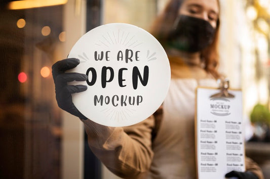 Free Woman Holding A Restaurant We Are Open Sign Psd