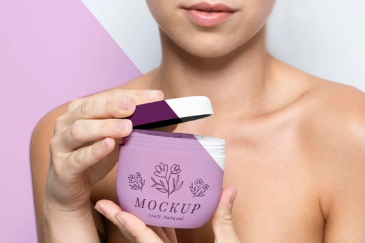 Free Woman Holding A Skincare Product Mock-Up Psd