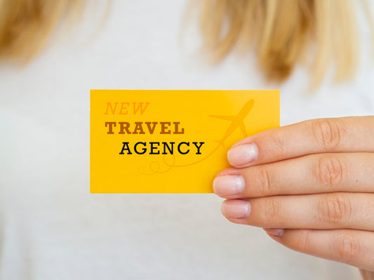 Free Woman Holding A Travel Agency Card Mock-Up Psd