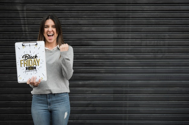 Free Woman Holding Clipboard Mockup With Black Friday Concept Psd