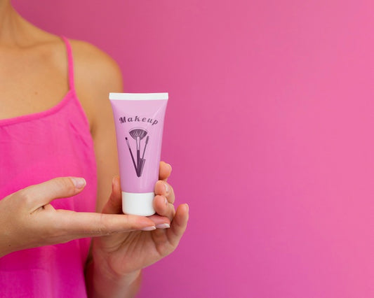 Free Woman Holding Cream Bottle Mock-Up With Copy Space Psd