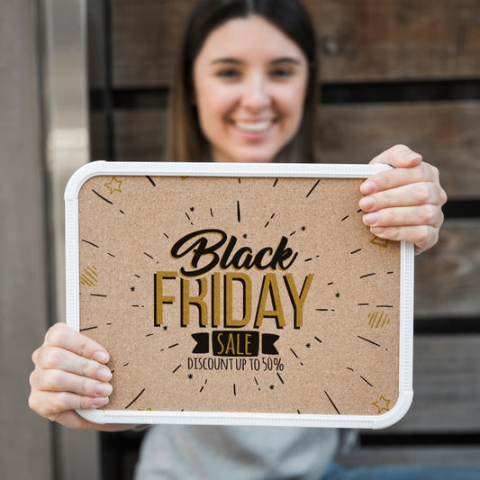 Free Woman Holding Frame Mockup With Black Friday Concept Psd